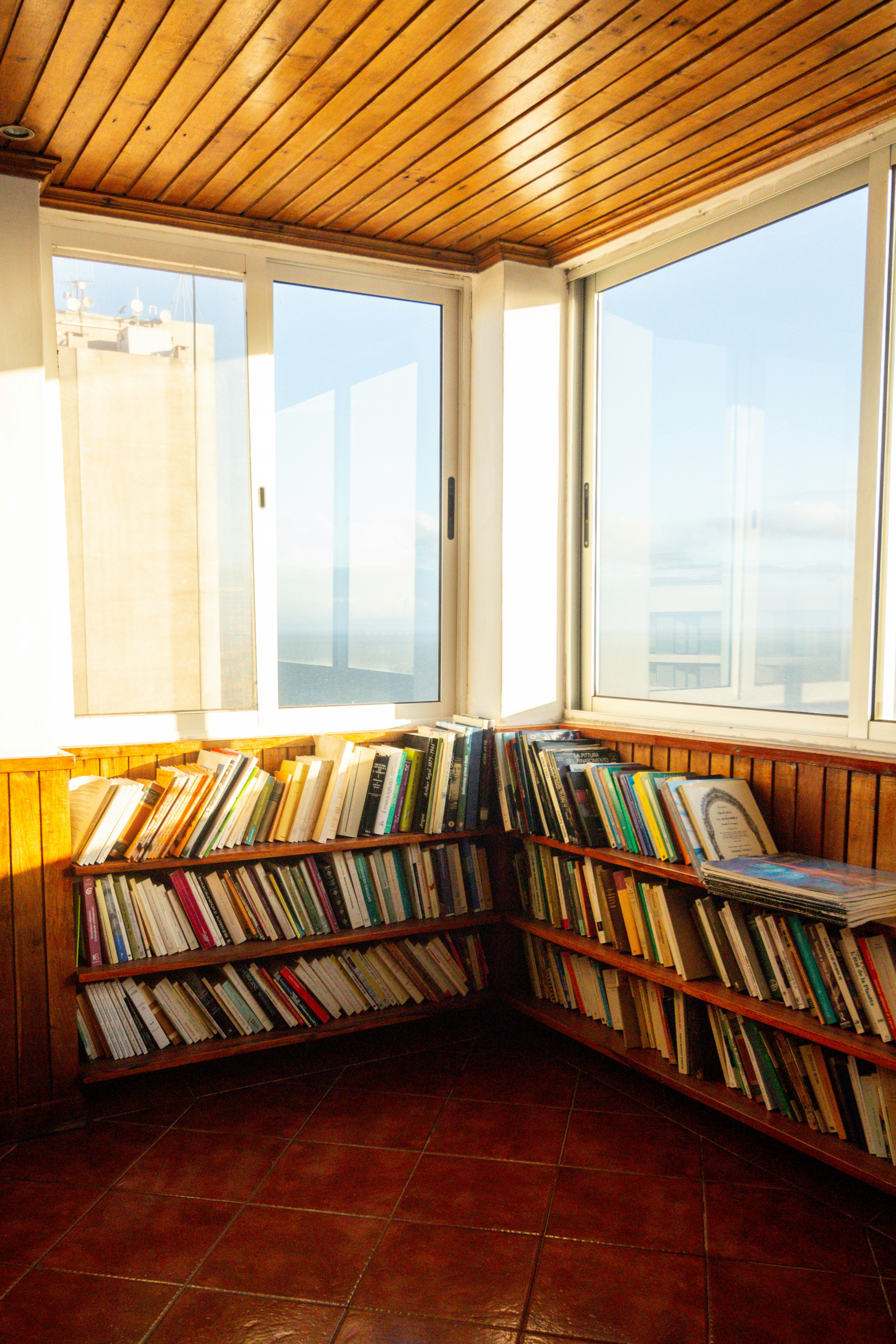 books on brown wooden shelf